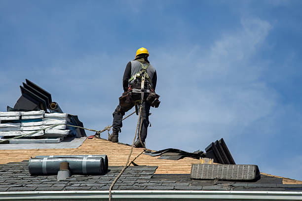 Professional Storm Damage Roof Repair technician working in Oregon, MO
